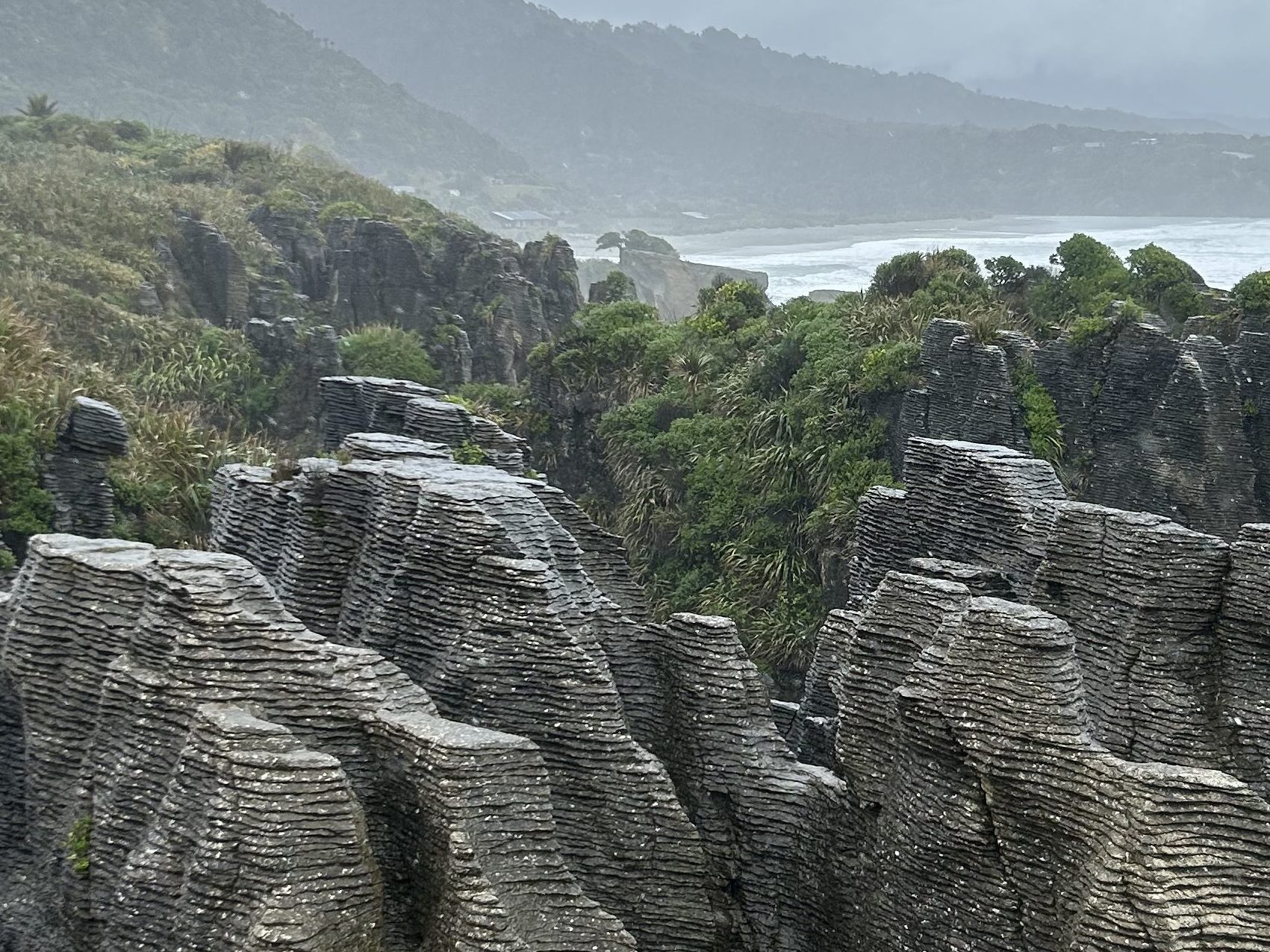 Punakaiki pancake rocks in New Zealand when raining in spring